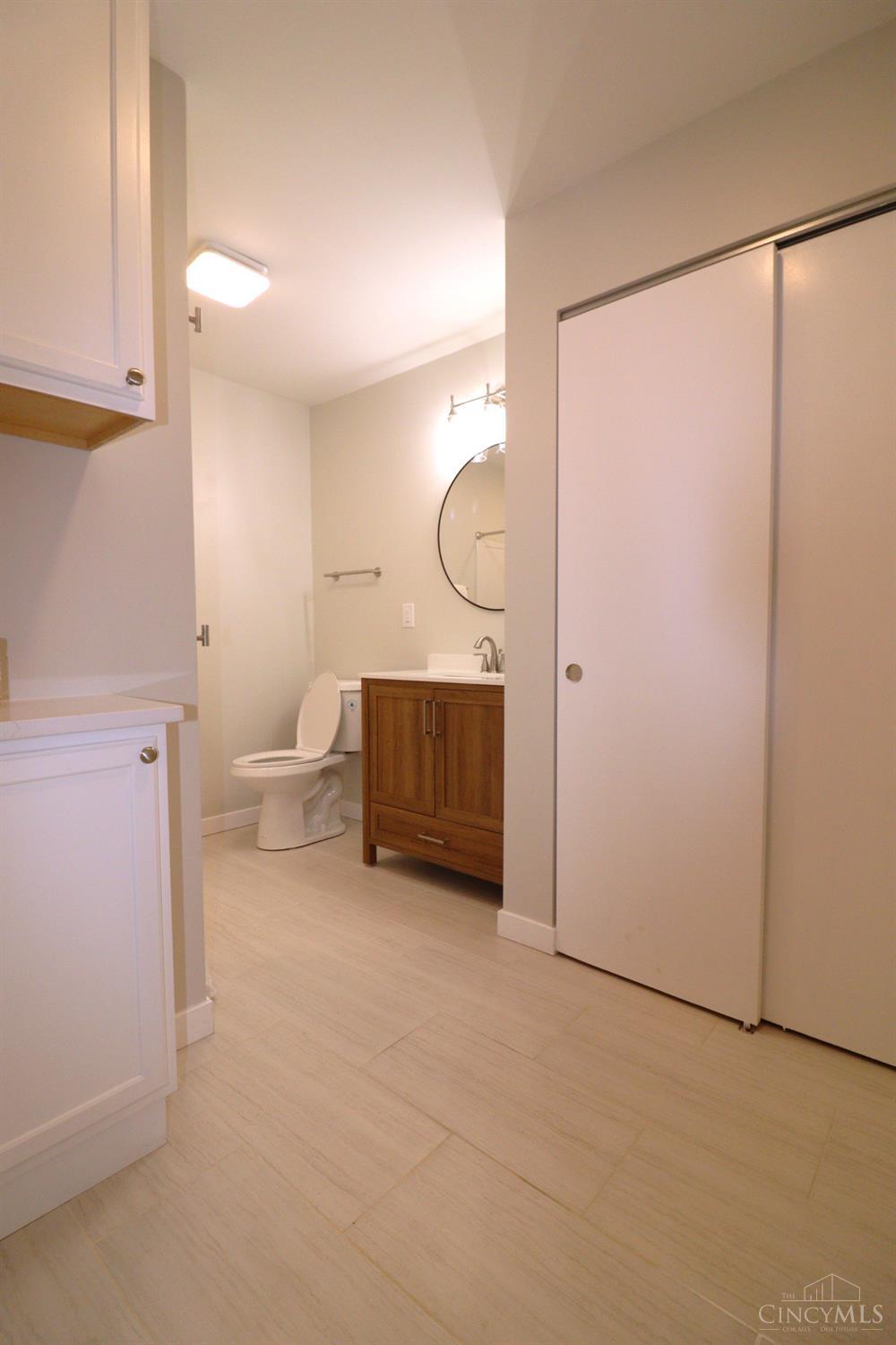 4731 Shephard Road Batavia, OH 45103 - Photo 20 of 25 New addition! A primary bathroom added off of the primary bedroom, on the main floor of Cape Cod home. A soothing tile with a linen look.