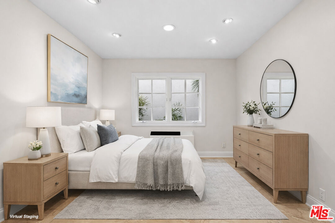 2305 Canyonback Road Los Angeles, CA 90049 - Photo 22 of 26 a bedroom with a bed and a dresser