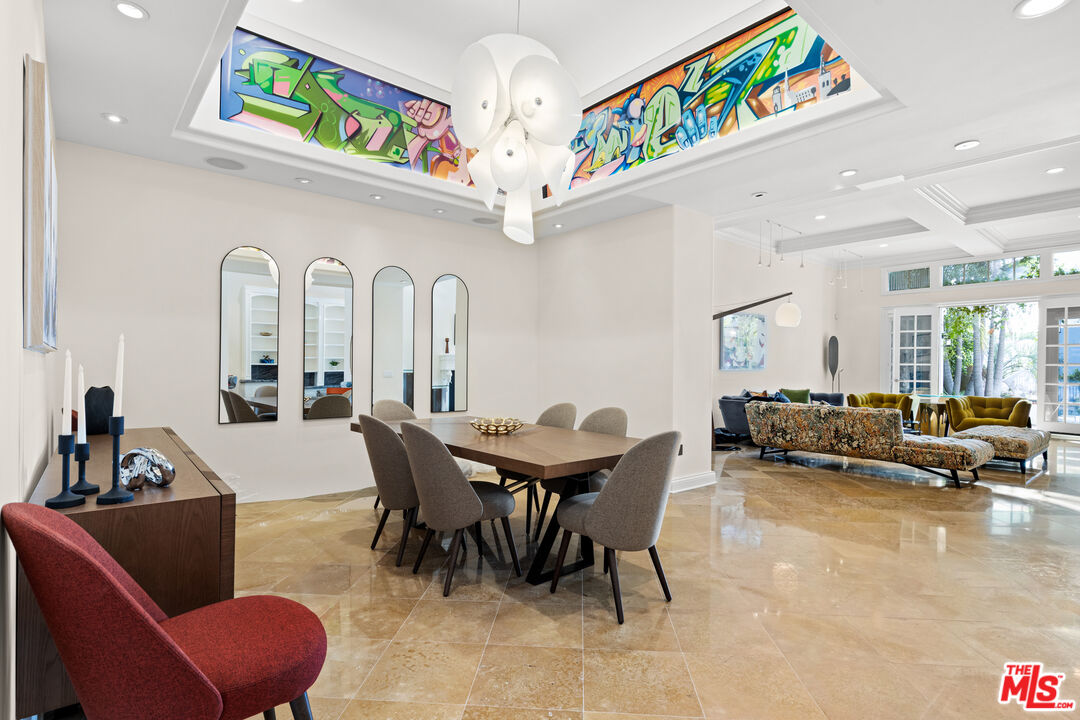 2305 Canyonback Road Los Angeles, CA 90049 - Photo 4 of 26 a living room with furniture and a chandelier