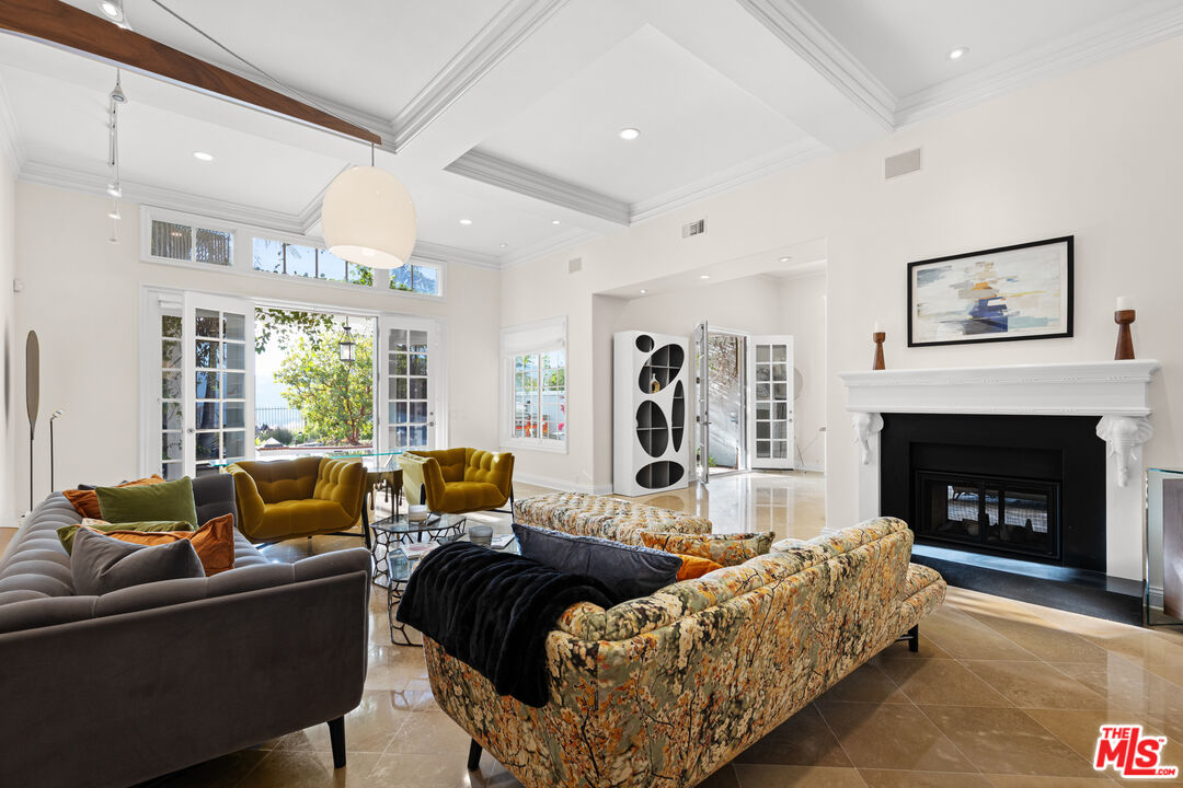 2305 Canyonback Road Los Angeles, CA 90049 - Photo 6 of 26 a living room with furniture and a fireplace