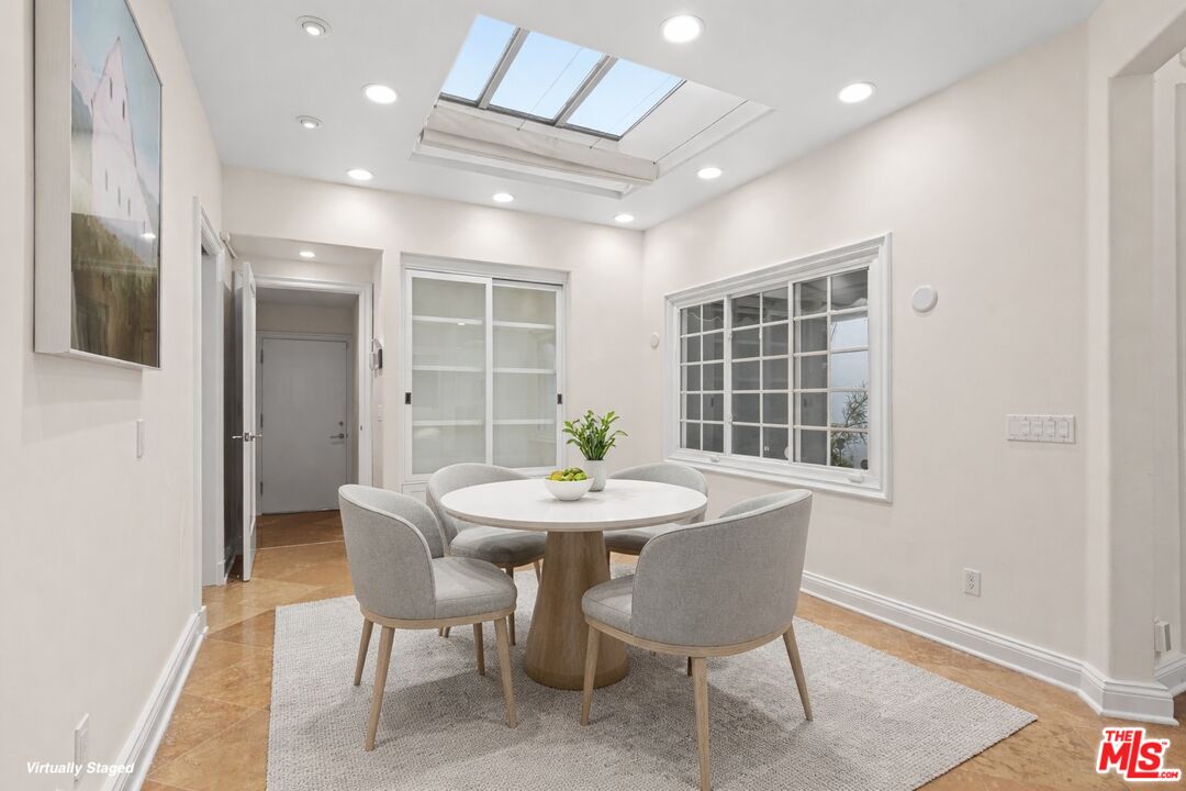 2305 Canyonback Road Los Angeles, CA 90049 - Photo 10 of 26 a dining room with furniture and window