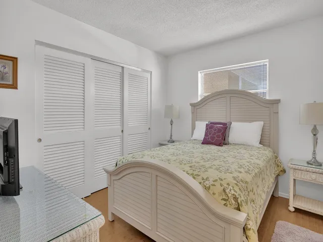 a bathroom with a shower a toilet and a sink