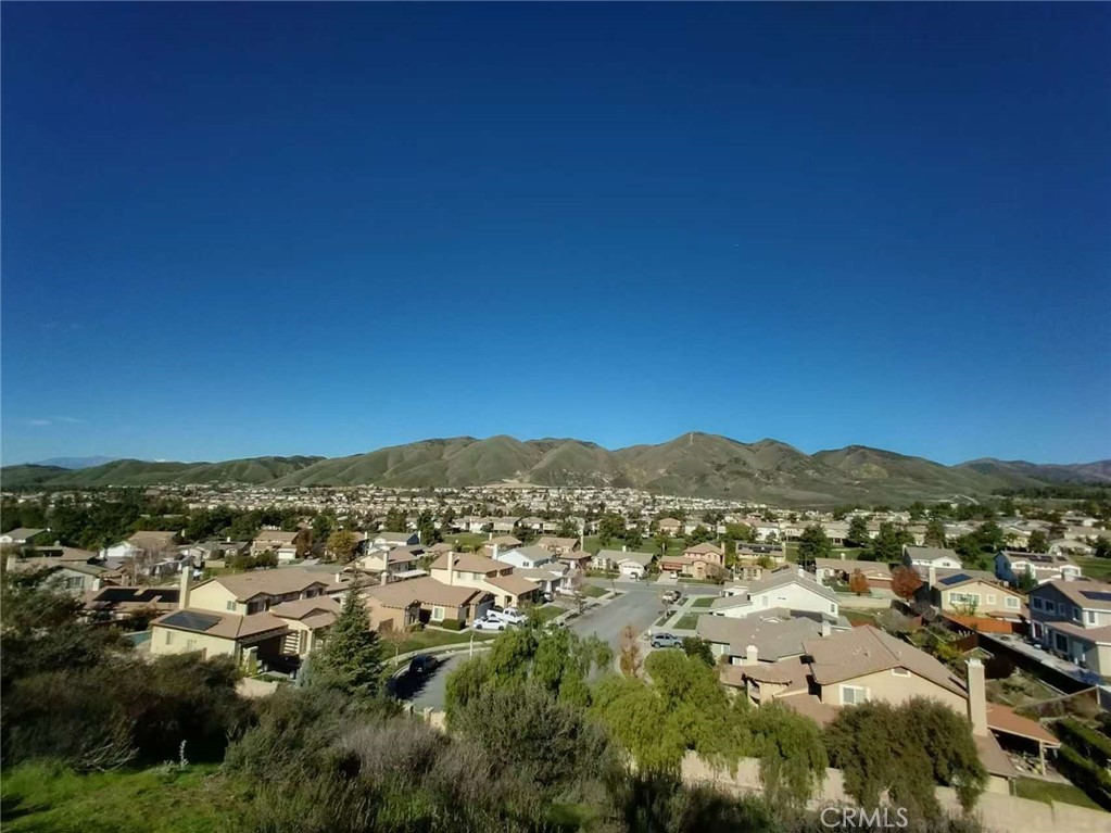 11811 Cramer Road Yucaipa, CA 92399 - Photo 51 of 56 an aerial view of residential houses with outdoor space and trees