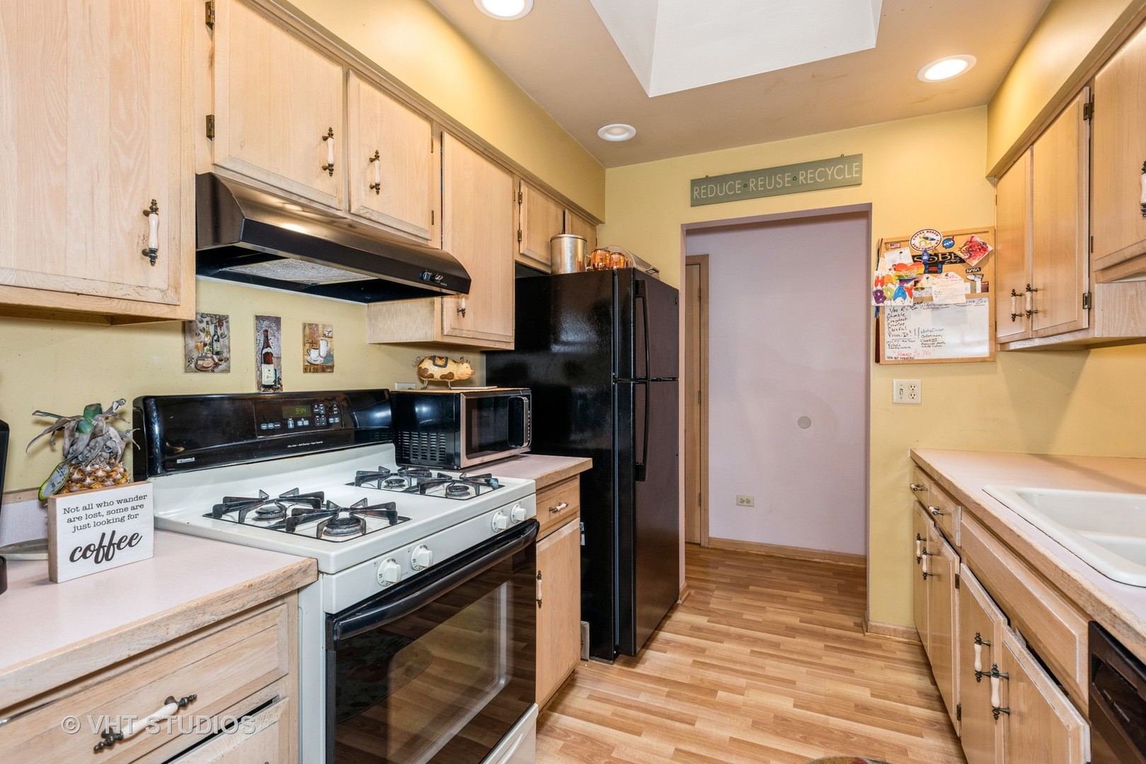 577 Yellowstone Drive Elgin, IL 60123 - Photo 10 of 30 a kitchen with stainless steel appliances granite countertop a sink stove and refrigerator