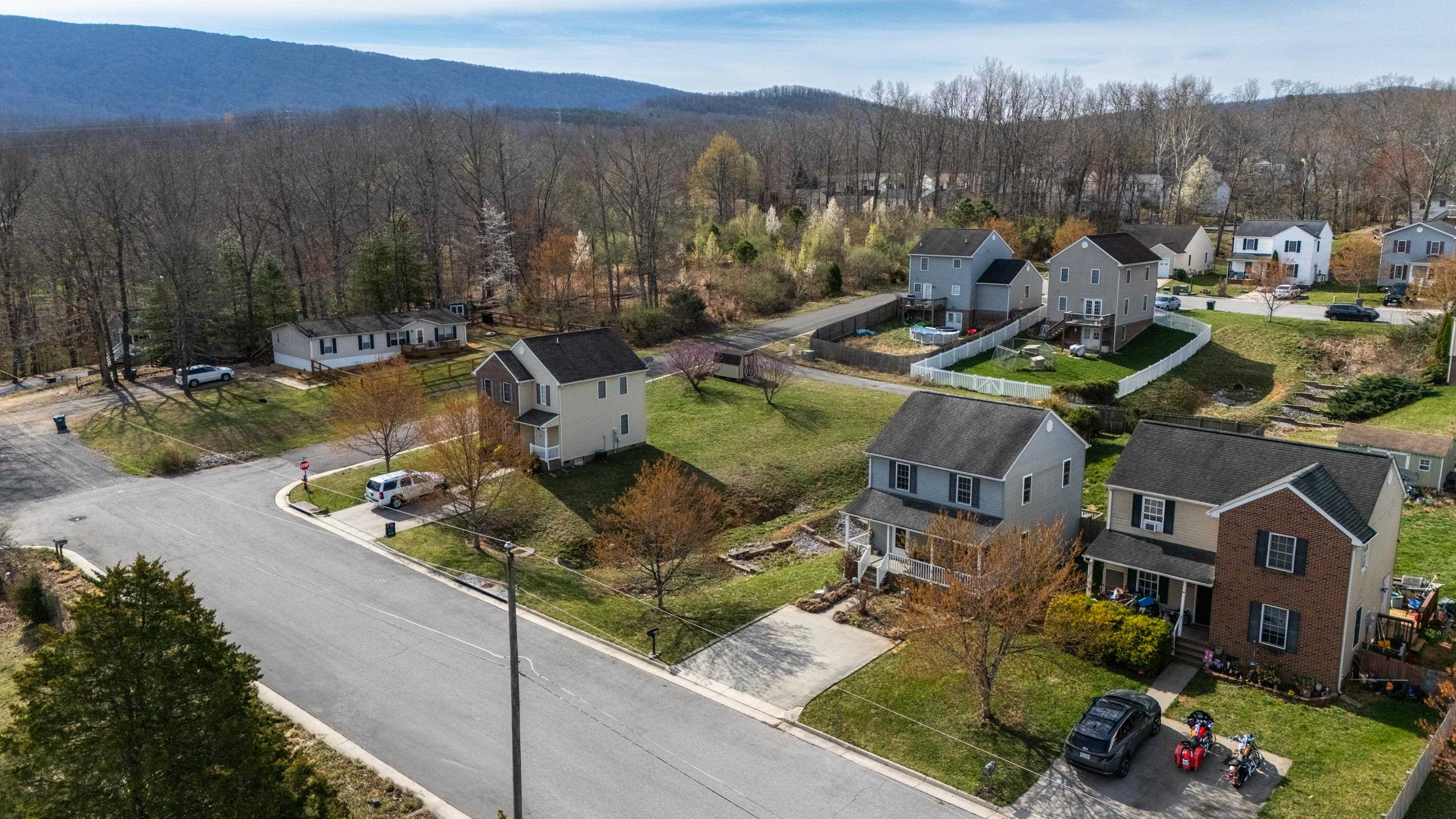 1520 3rd Street Waynesboro, VA 22980 - Photo 52 of 55 an aerial view of a house with a garden and lake view
