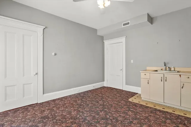 a view of a utility room with closet