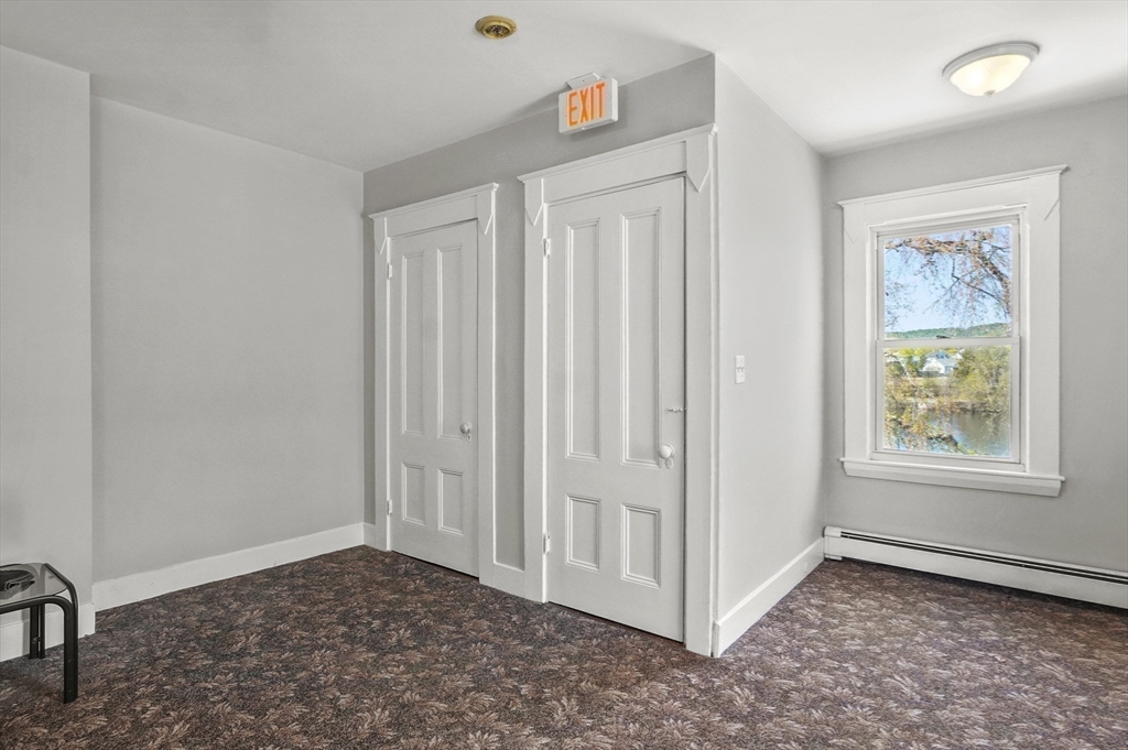 55-57 Crescent Street Waltham, MA 02453 - Photo 28 of 37 a view of an empty room and window