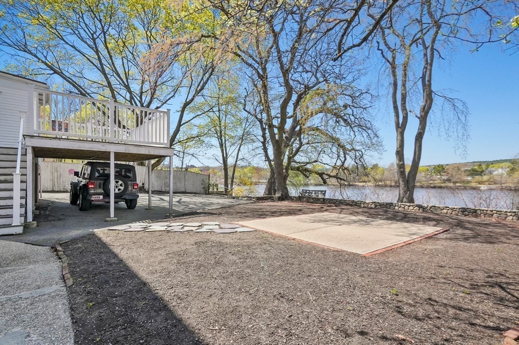 55-57 Crescent Street Waltham, MA 02453 - Photo 32 of 37 a view of a house with a yard covered in snow