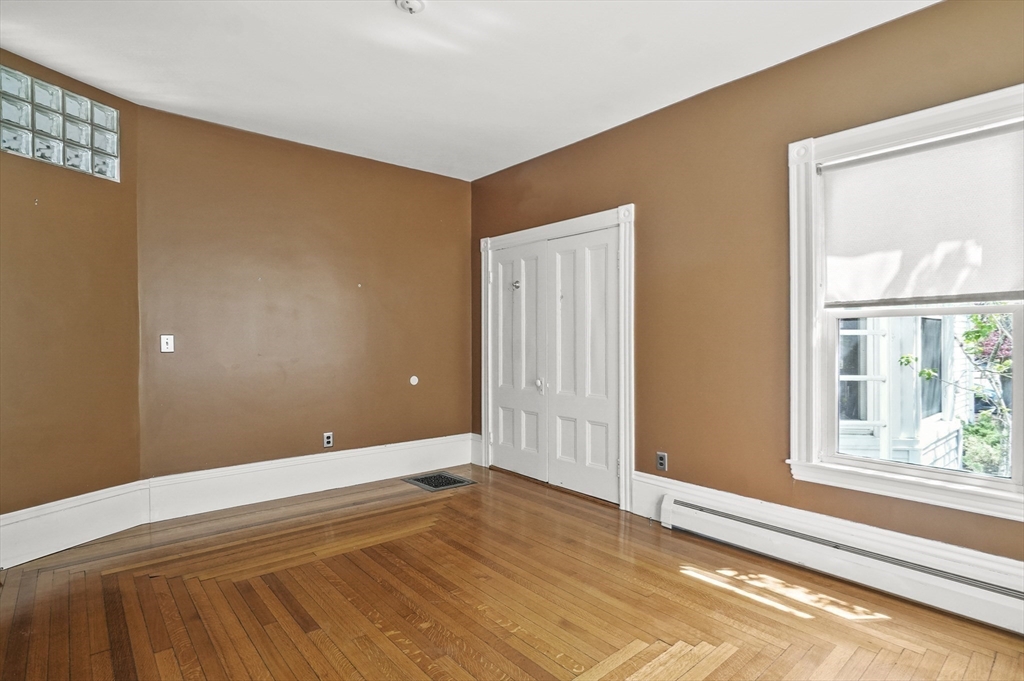 55-57 Crescent Street Waltham, MA 02453 - Photo 8 of 37 a view of an empty room with a window