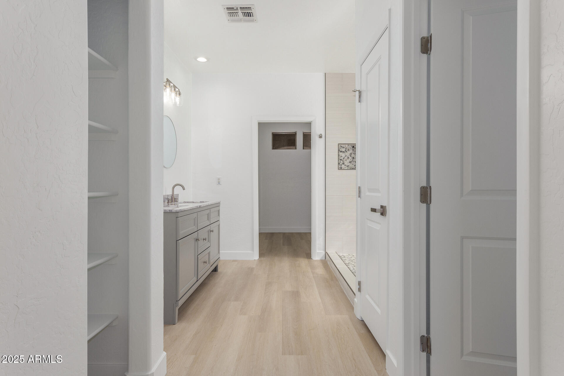 41401 North Maidstone Court Anthem, AZ 85086 - Photo 18 of 53 a view of a hallway with closet and a bathroom