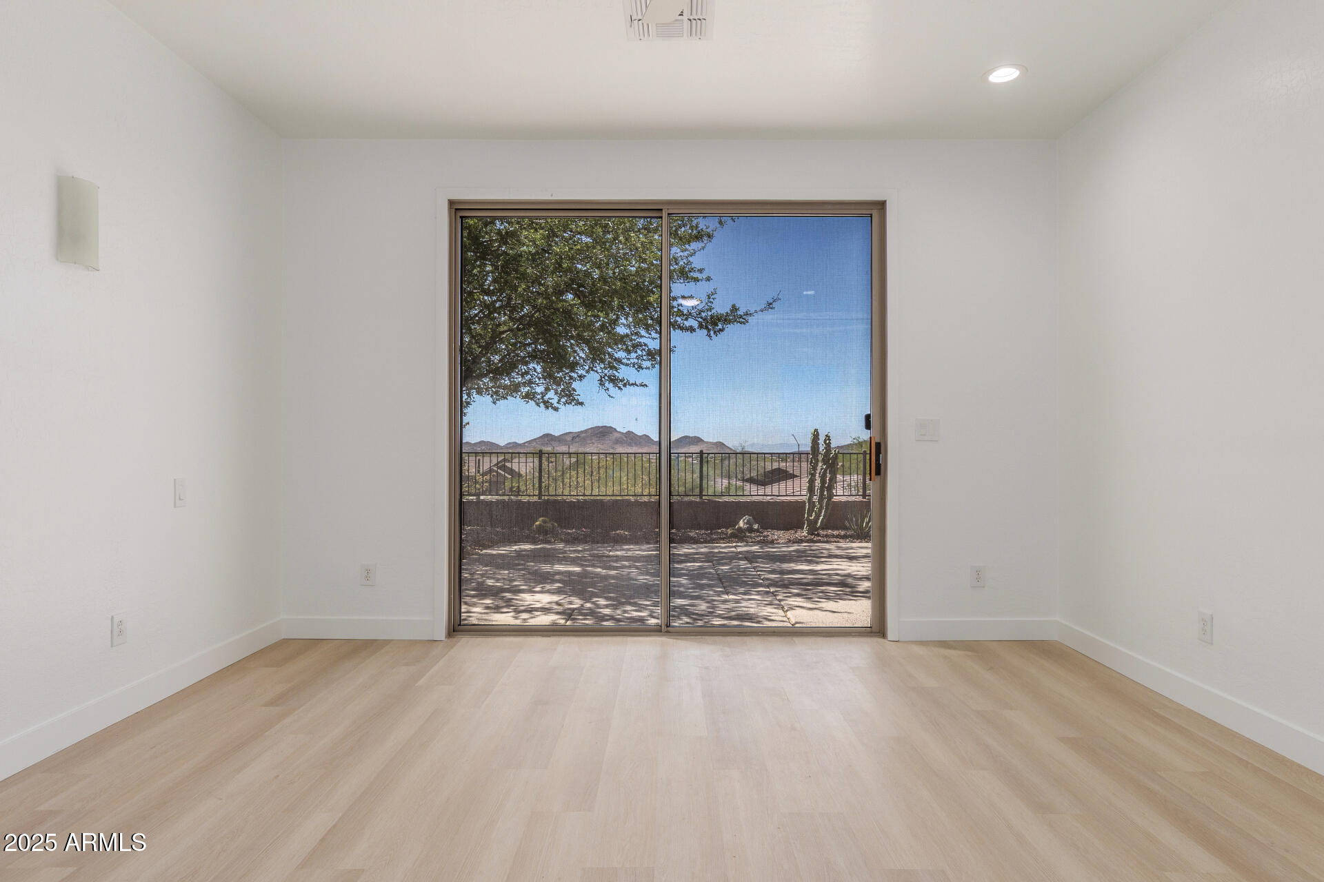 41401 North Maidstone Court Anthem, AZ 85086 - Photo 22 of 53 an empty room with sliding door