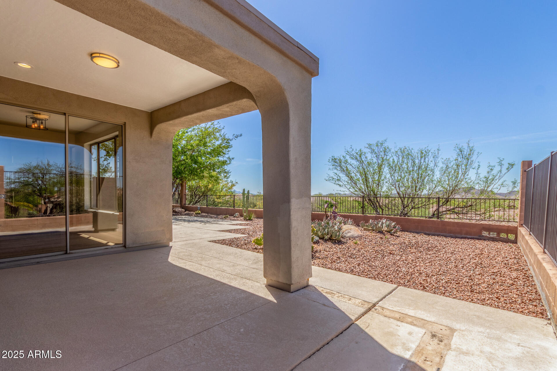 41401 North Maidstone Court Anthem, AZ 85086 - Photo 29 of 53 a view of a porch with a floor to ceiling window and a rug