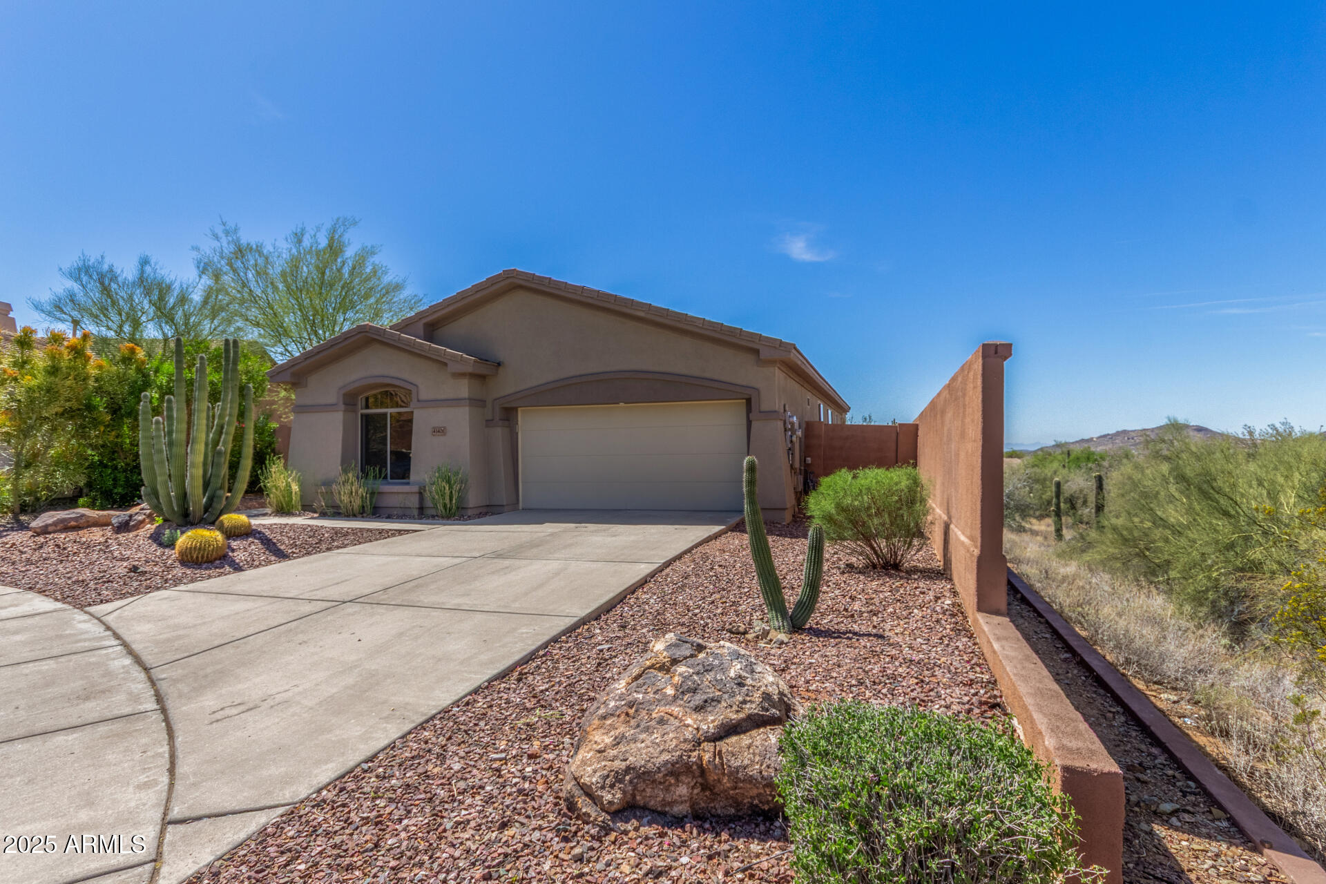 41401 North Maidstone Court Anthem, AZ 85086 - Photo 50 of 53 a front view of a house with garden