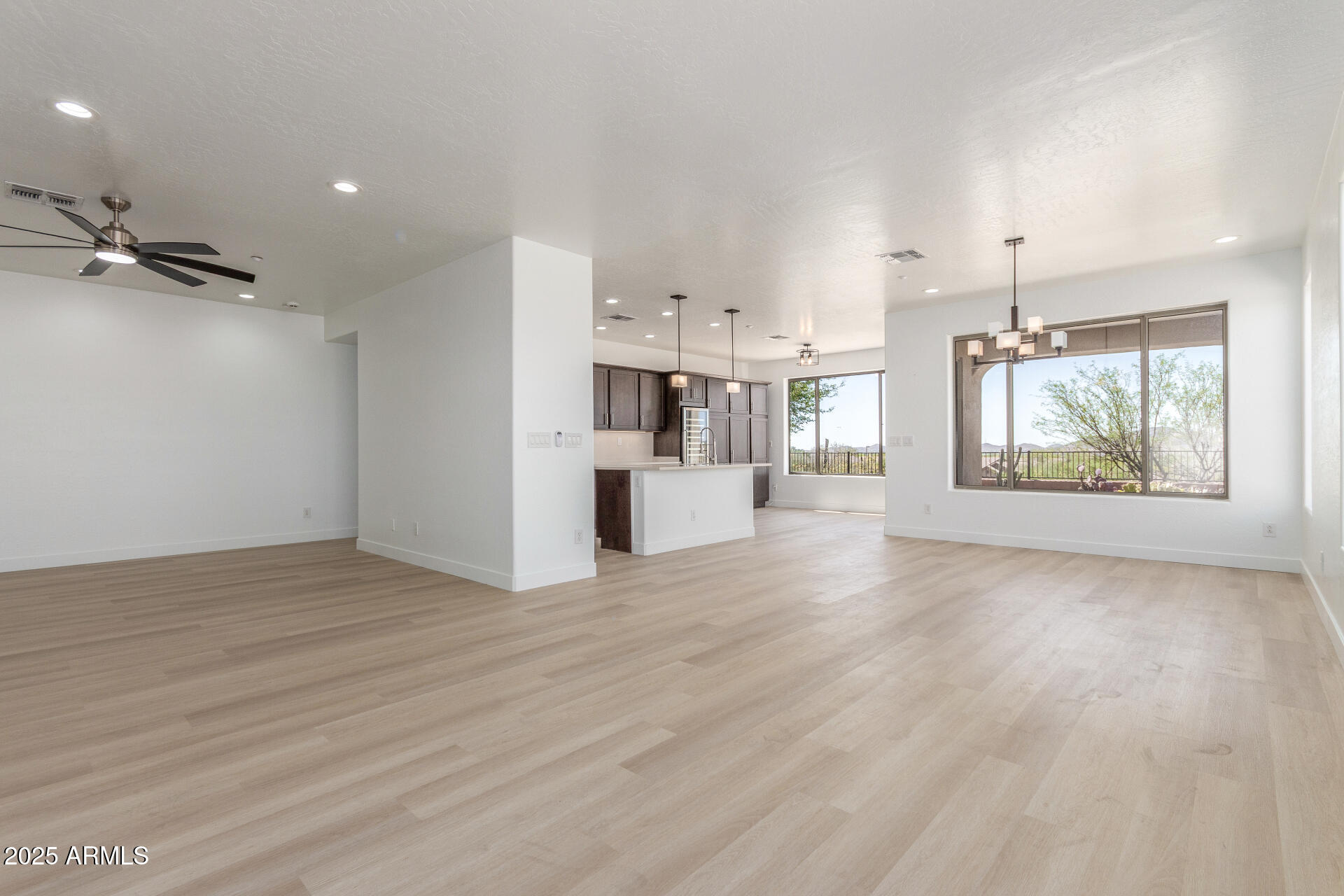41401 North Maidstone Court Anthem, AZ 85086 - Photo 6 of 53 a view of a kitchen with furniture and wooden floor
