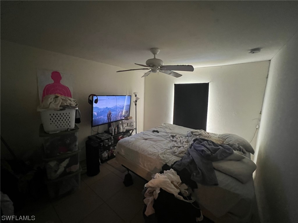 5311 Banning Street Lehigh Acres, FL 33971 - Photo 12 of 21 a bedroom with bed and a window