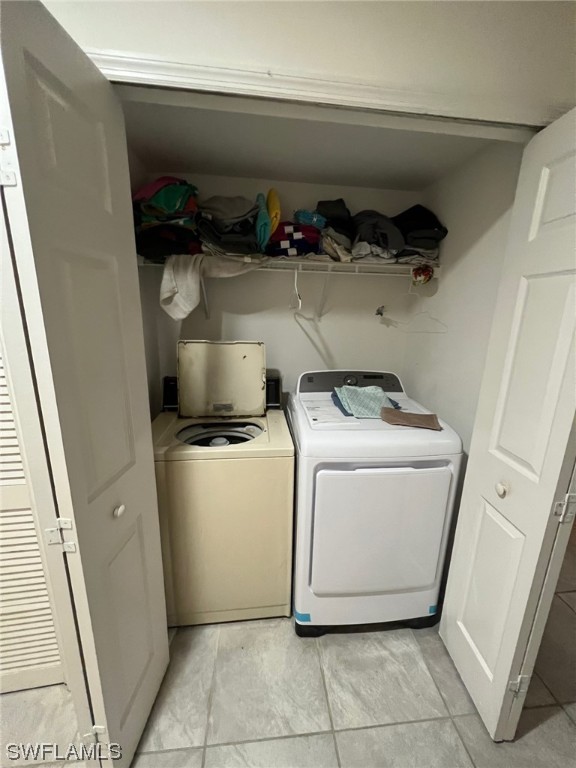 5311 Banning Street Lehigh Acres, FL 33971 - Photo 17 of 21 a utility room with dryer and washer