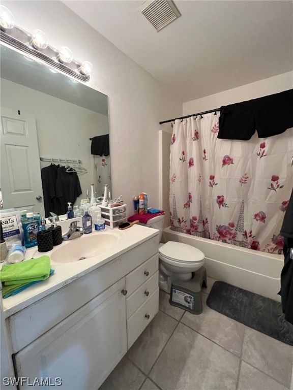 5311 Banning Street Lehigh Acres, FL 33971 - Photo 18 of 21 a bathroom with a double vanity sink mirror and toilet