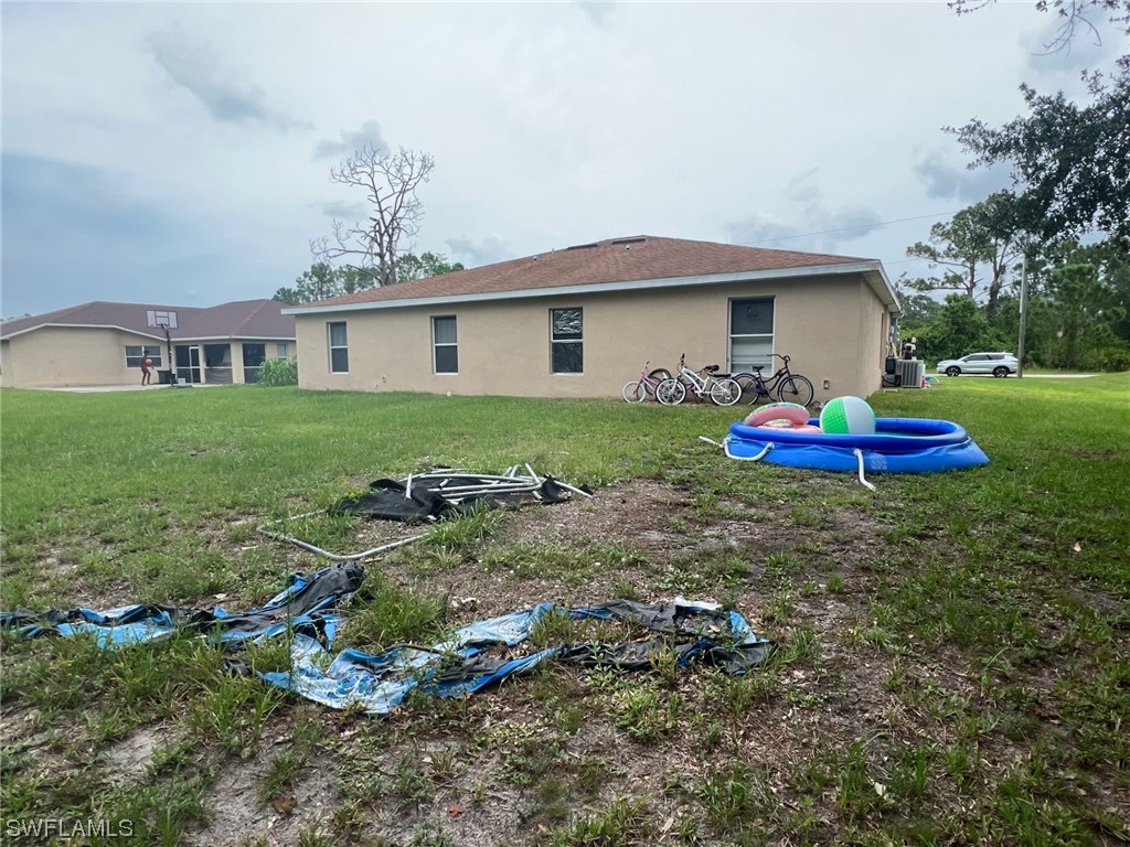 5311 Banning Street Lehigh Acres, FL 33971 - Photo 5 of 21 a view of a house with a yard