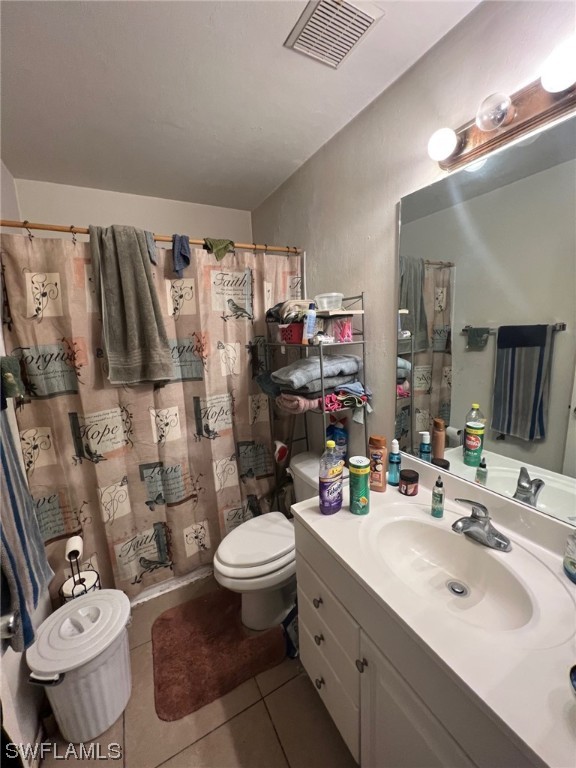 5311 Banning Street Lehigh Acres, FL 33971 - Photo 10 of 21 a bathroom with a sink toilet mirror and shower