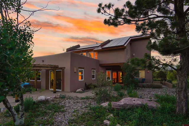 a spacious bedroom with a bed and a large window