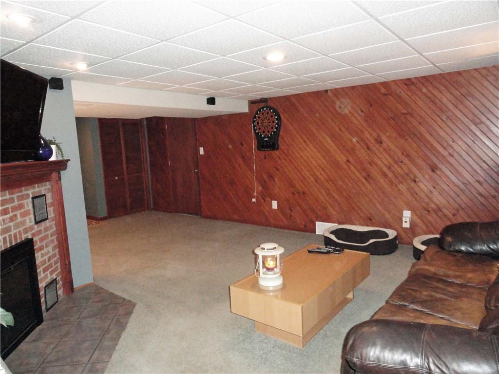 541 First Street North Huntingdon, PA 15642 - Photo 19 of 24 Finished, 24' lower level family room with wood burning fireplace and walkout basement