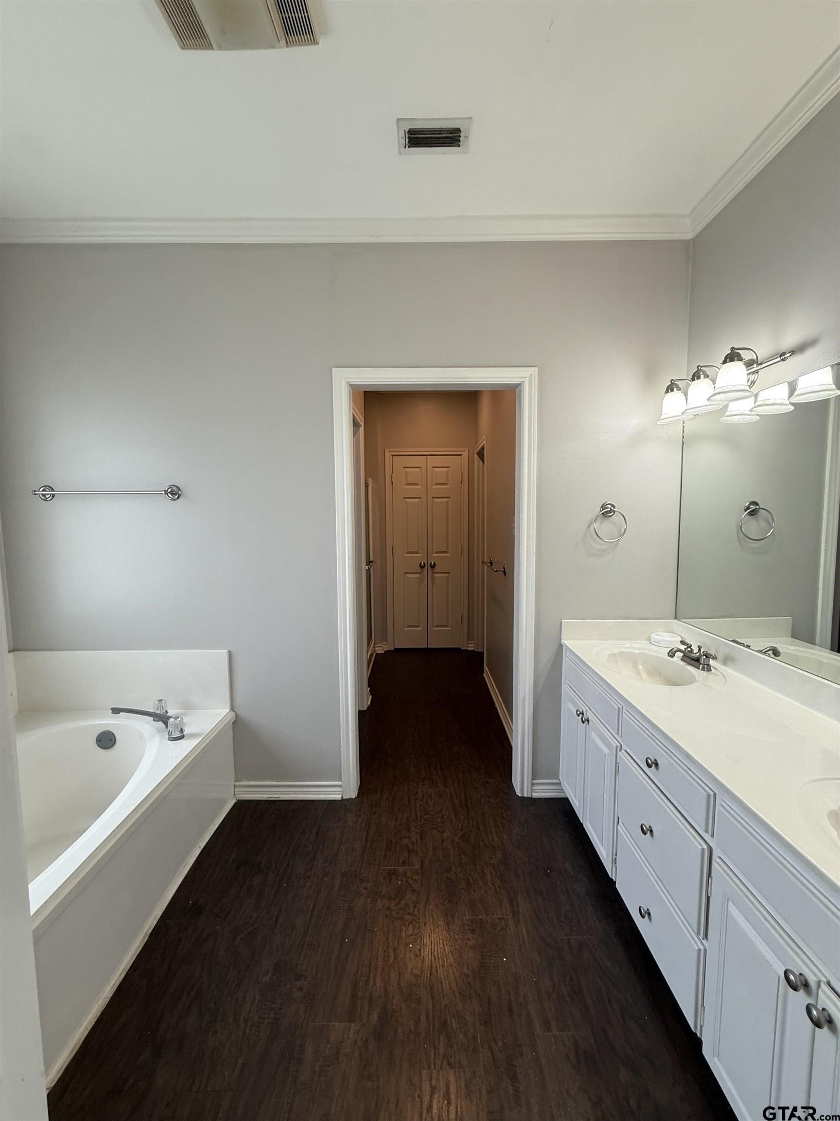 3204 Pebblebrook Circle Tyler, TX 75707 - Photo 9 of 18 a spacious bathroom with a tub sink shower and mirror