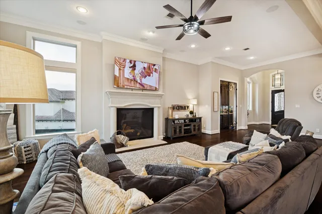 a living room with furniture fireplace and flat screen tv