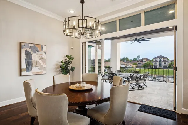 a view of a patio with a table chairs and backyard