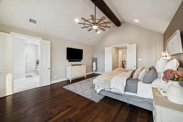 a living room with furniture a flat screen tv and a large window
