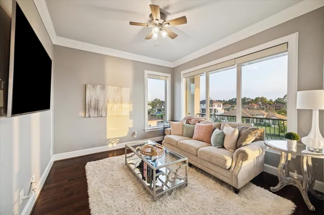 a large bedroom with a large bed and flat screen tv