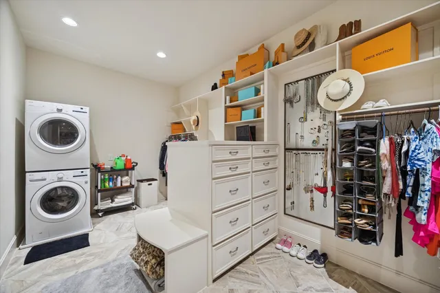a bedroom with a bed and a flat tv screen on dresser
