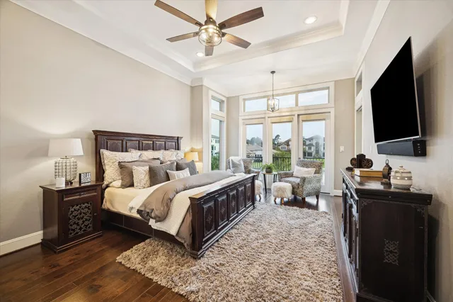 a bedroom with a bed and ceiling fan