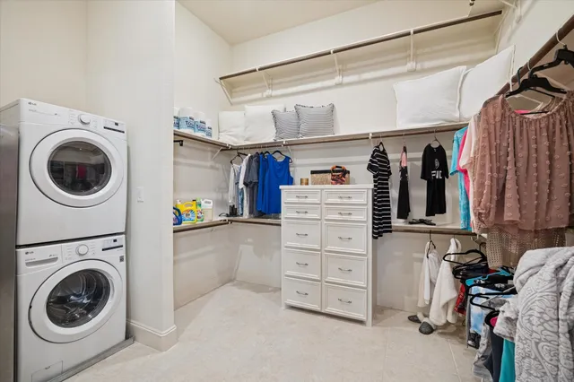 a bedroom with a bed and a potted plant