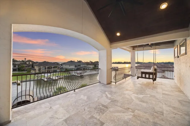 a view of a balcony dining table and chairs