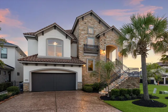 a living room with furniture ceiling fan and a fireplace
