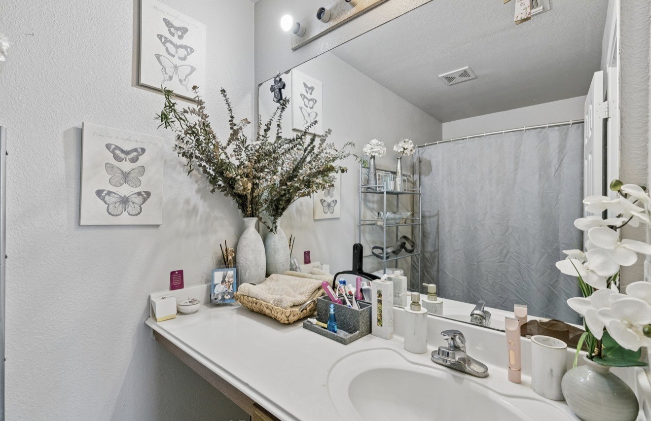 7118 Rising Brook Drive Cypress, TX 77433 - Photo 14 of 21 a bathroom with a sink mirror and vanity