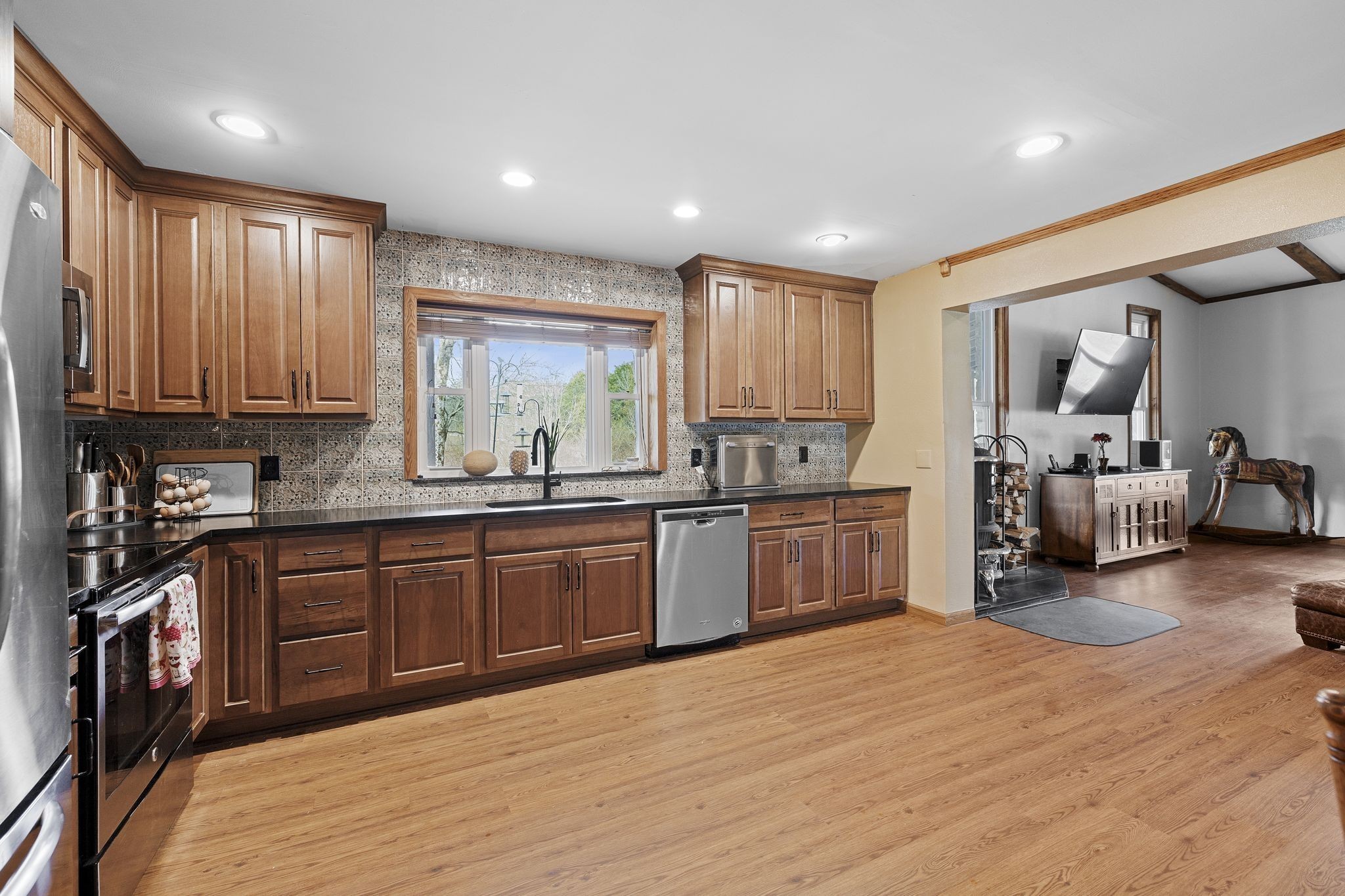 10669 South Windrow Road Rockvale, TN 37153 - Photo 13 of 53 a kitchen with stainless steel appliances granite countertop wooden cabinets a sink and dishwasher
