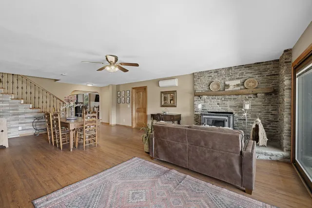 a view of fireplace and livingroom with wooden floor
