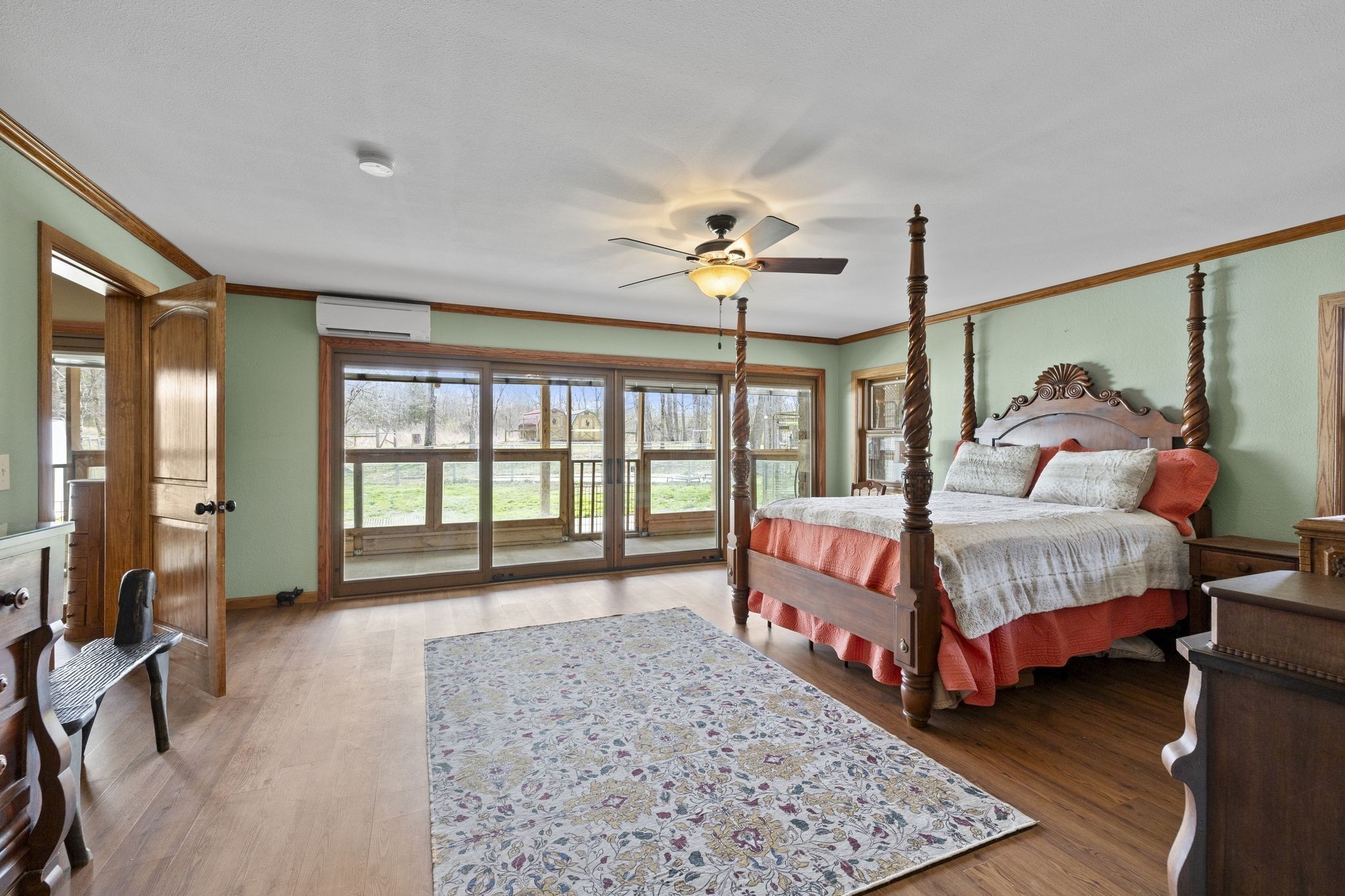 10669 South Windrow Road Rockvale, TN 37153 - Photo 21 of 53 a bedroom with a bed mirror and a large window