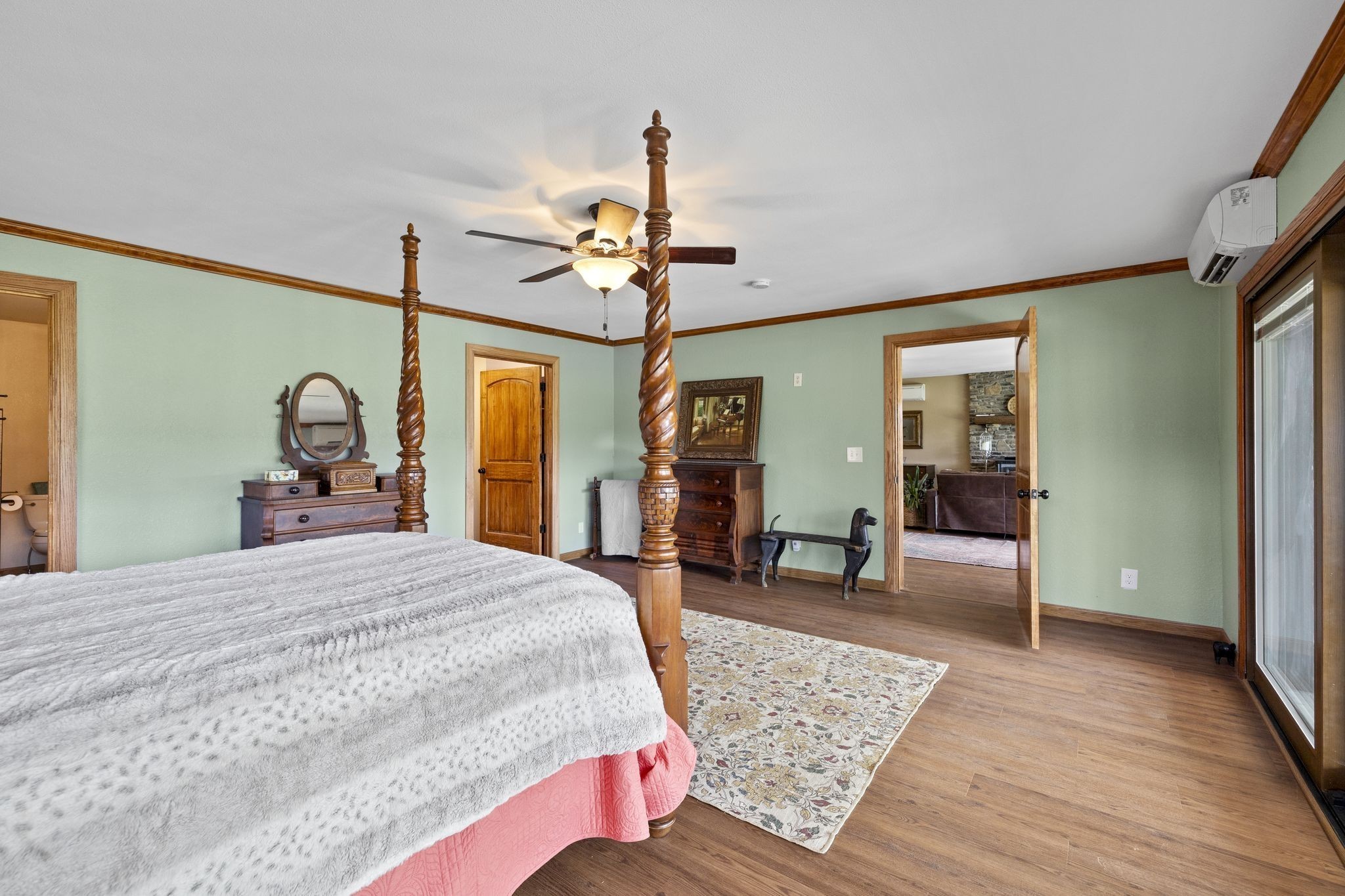 10669 South Windrow Road Rockvale, TN 37153 - Photo 22 of 53 a bedroom with a bed large mirror and a chandelier