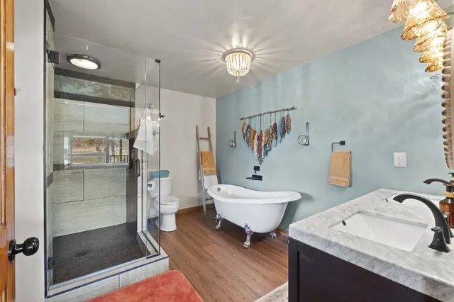 a room with furniture and wooden floor