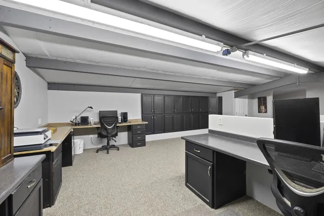 a workspace with furniture and window