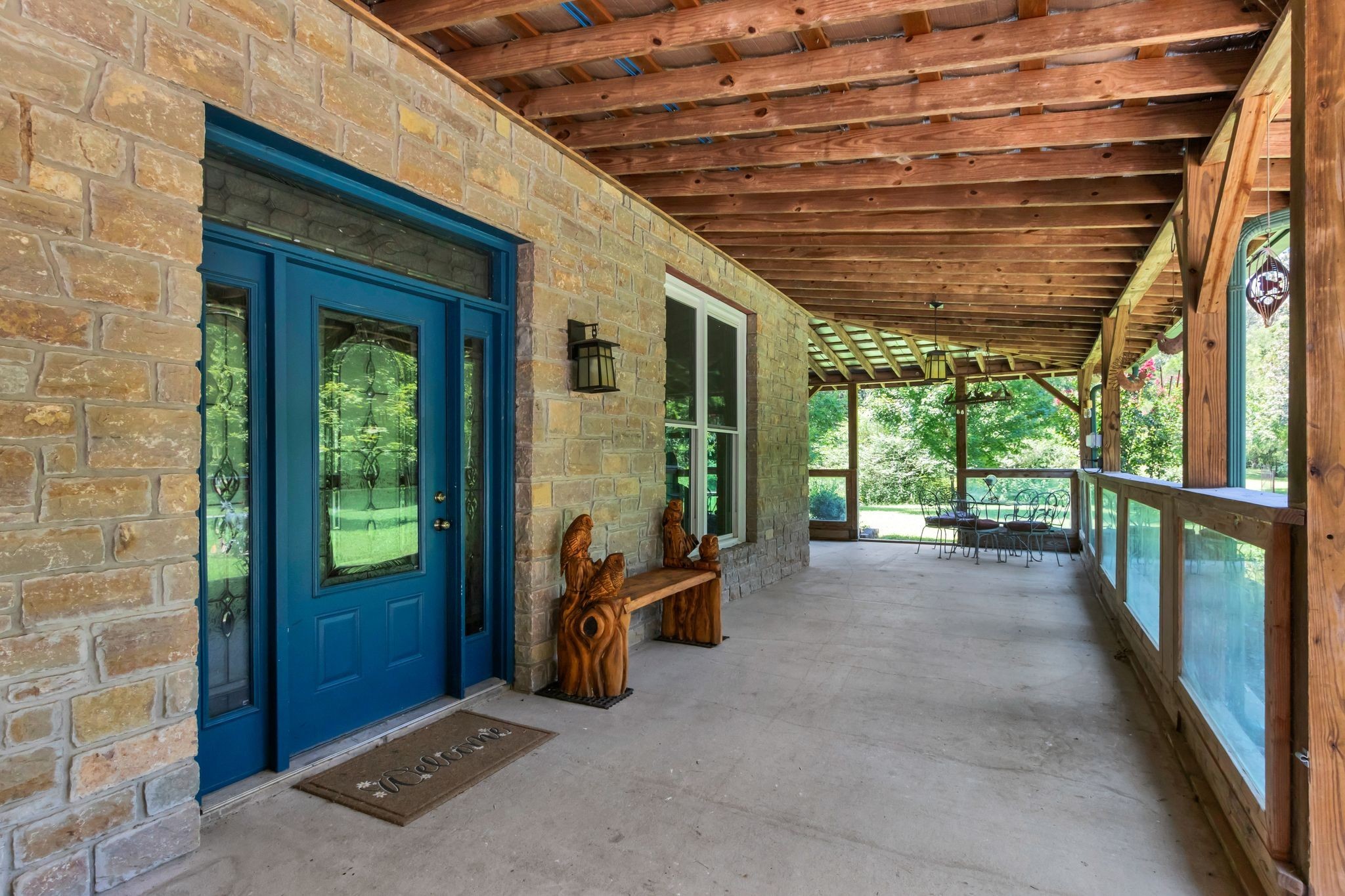 10669 South Windrow Road Rockvale, TN 37153 - Photo 6 of 53 a view of a porch with a table and chairs