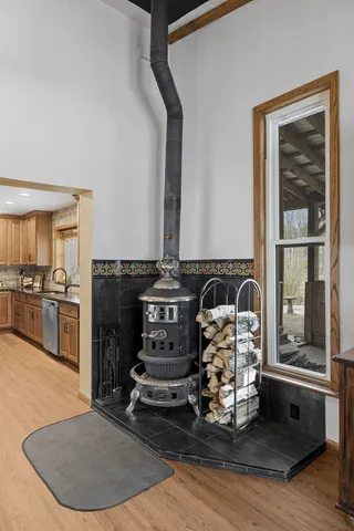 a view of a kitchen with kitchen island a counter top space a sink and appliances