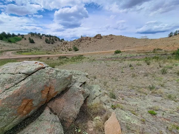 a view of a road with an ocean