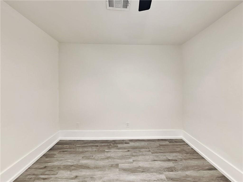 4013 Hawthorne Circle, Unit 2 Smyrna, GA 30080 - Photo 13 of 18 a view of an empty room and wooden floor