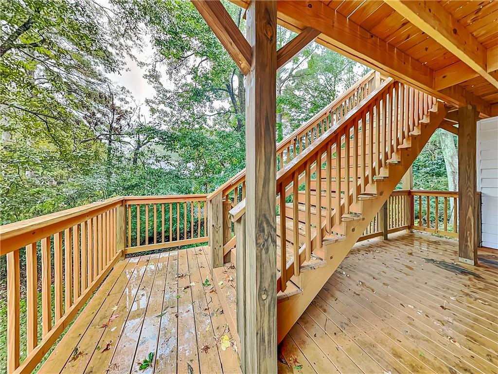 4013 Hawthorne Circle, Unit 2 Smyrna, GA 30080 - Photo 17 of 18 a view of balcony with wooden floor and fence