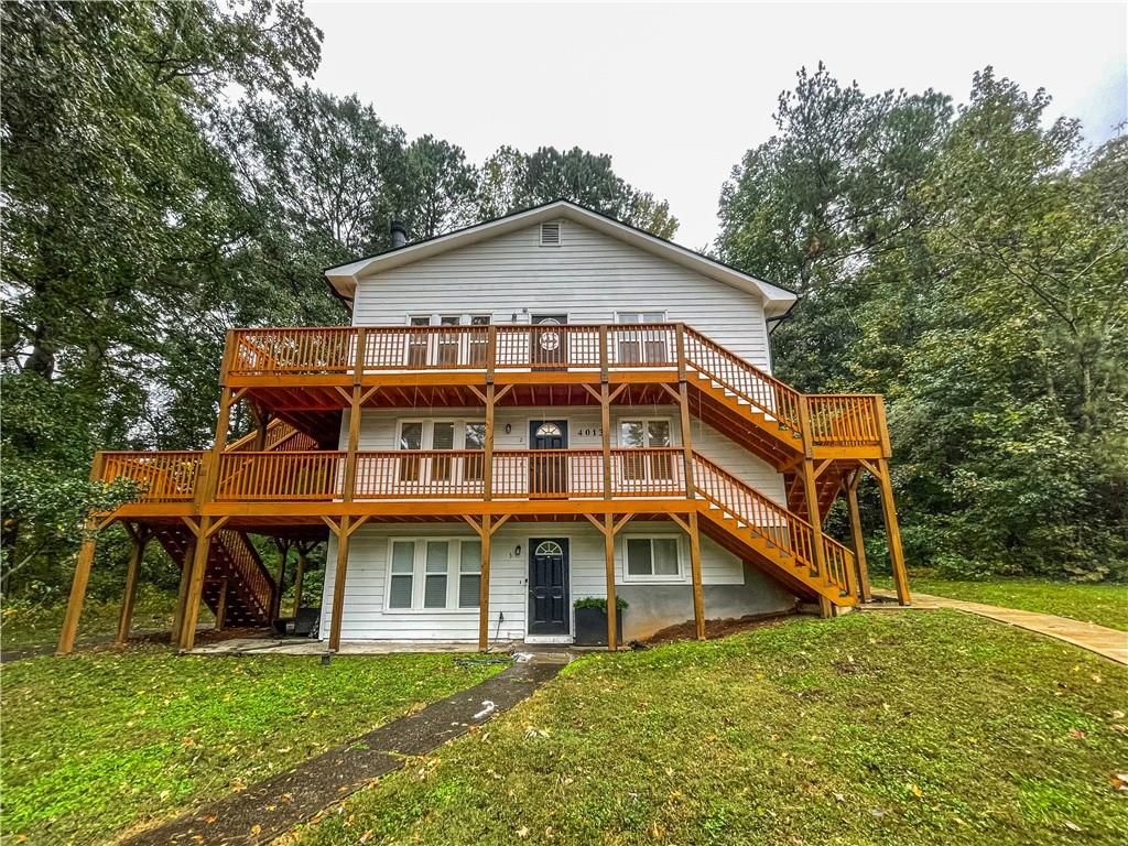 4013 Hawthorne Circle, Unit 2 Smyrna, GA 30080 - Photo 2 of 18 a view of a house with a yard