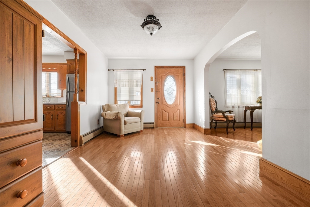 256 Rhode Island Avenue Fall River, MA 02724 - Photo 11 of 36 a living room with furniture and a fireplace