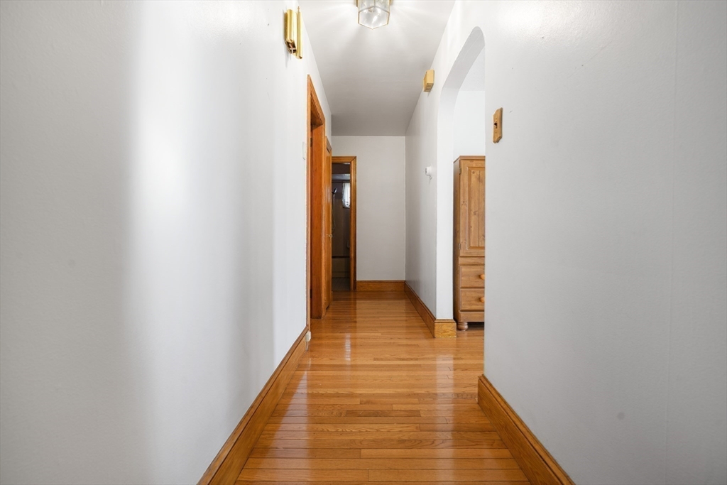 256 Rhode Island Avenue Fall River, MA 02724 - Photo 22 of 36 a view of a hallway with wooden floor
